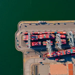 Aerial view of California port and agricultural fields impacted by tariffs