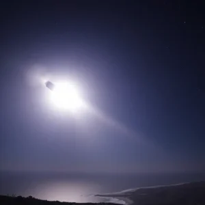 SpaceX Dragon spacecraft reentering atmosphere with sonic boom