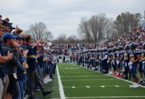 Players celebrating their victory during the Battle of the Bay football game